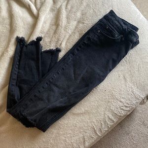 Distressed cutoff back skinny jeans